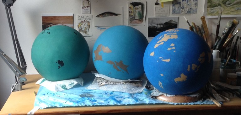 three globes cropped